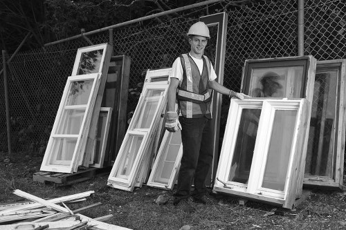 Professional team assessing furniture for clearance in Bow