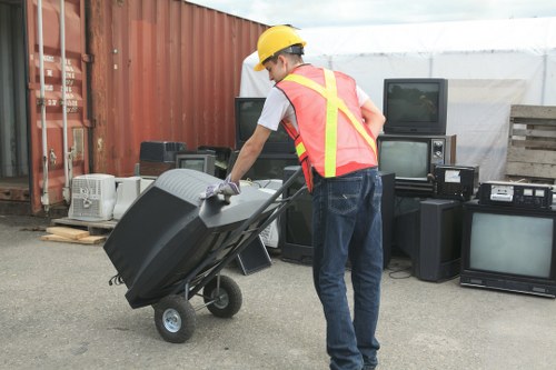 Residents donating furniture at a local center in Bow
